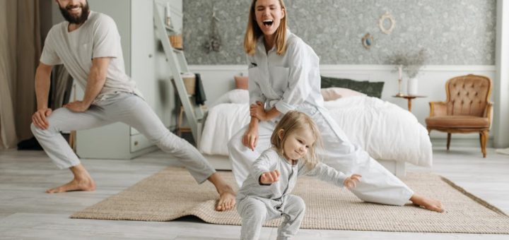 A joyful family engaging in morning stretches together, fostering a fun and healthy routine.